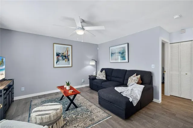 a living room with furniture and a rug