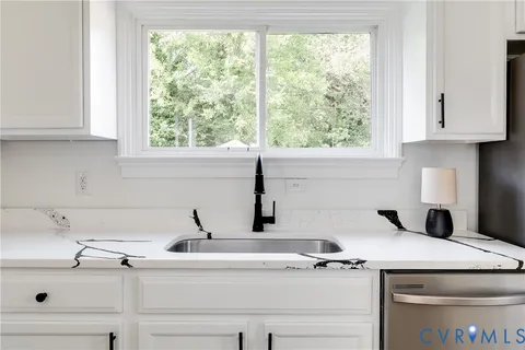 a kitchen with a sink and a window