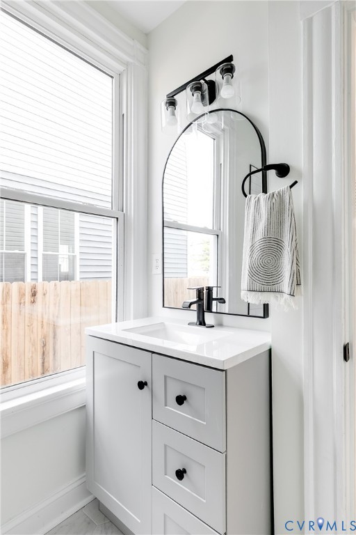 2413 Ingram Avenue Richmond, VA 23224 - Photo 21 of 43 a bathroom with a sink and a mirror