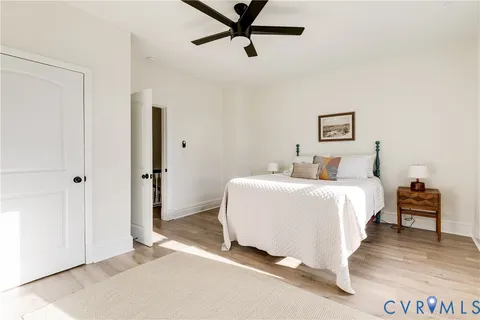 a bedroom with a bed and cabinets