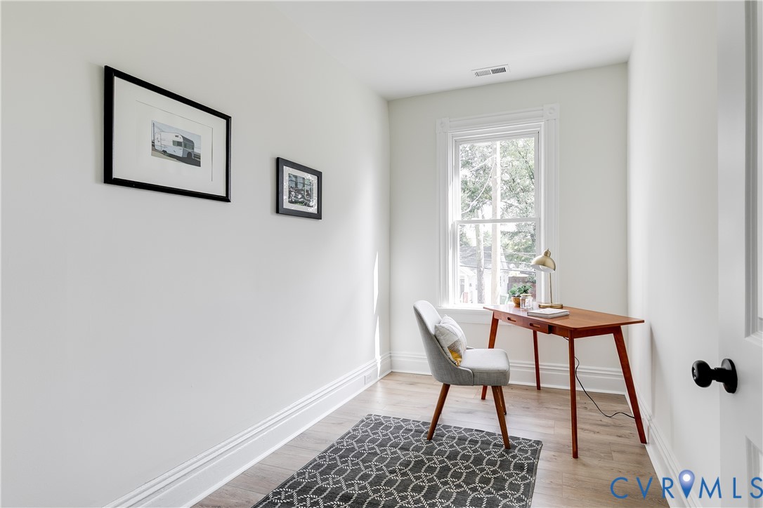 2413 Ingram Avenue Richmond, VA 23224 - Photo 36 of 43 a view of a workspace with furniture and a window