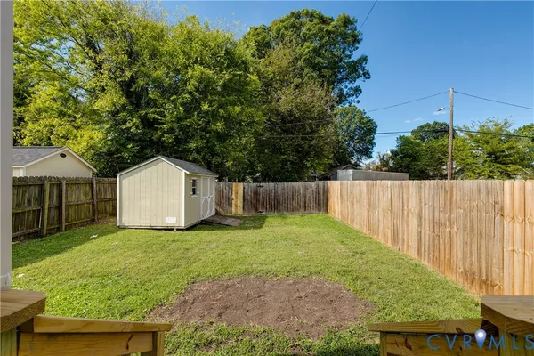 a view of a back yard of the house