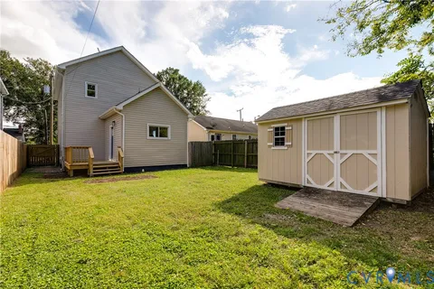 a view of a backyard of the house