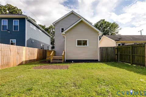 a view of a backyard with a small cabin