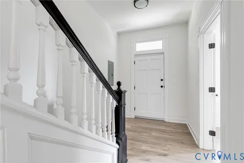 a view of entryway with wooden floor