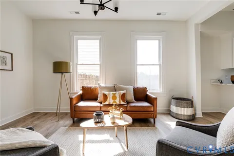 a living room with furniture and a window