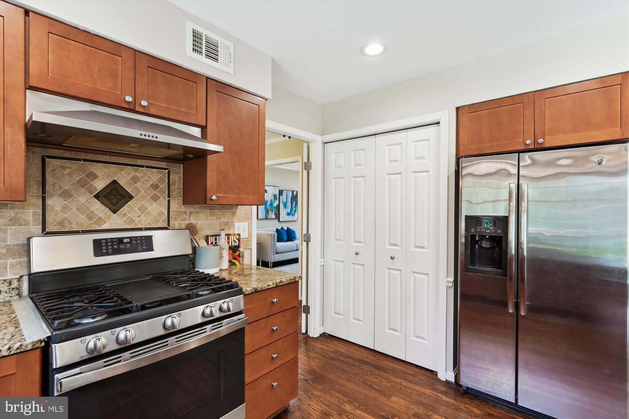 5427 Rilian Court Burke, VA 22015 - Photo 10 of 63 a kitchen with stainless steel appliances granite countertop a refrigerator stove and sink