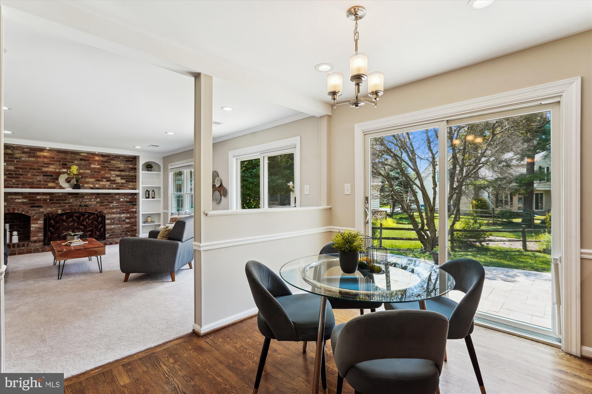 5427 Rilian Court Burke, VA 22015 - Photo 63 of 63 a dining room with furniture a chandelier and wooden floor