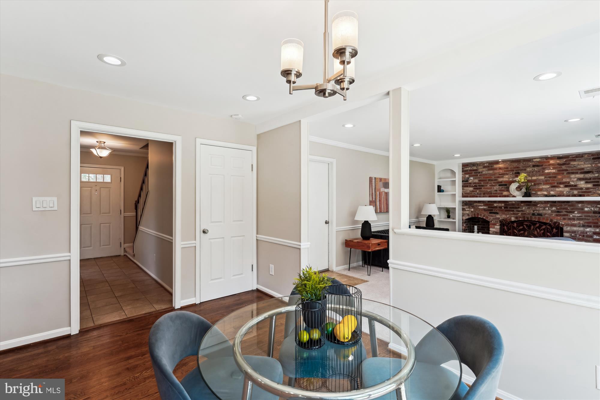 5427 Rilian Court Burke, VA 22015 - Photo 14 of 63 a living room with furniture and a chandelier