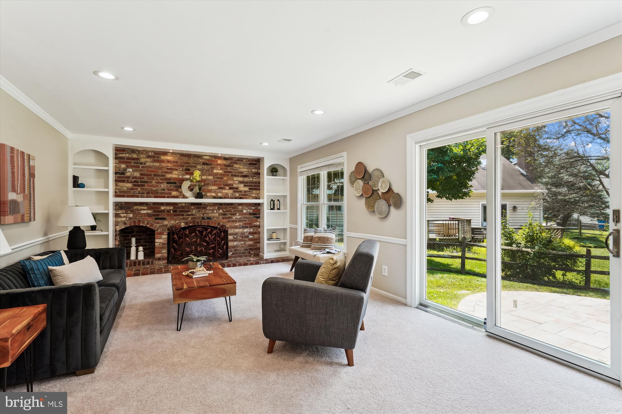 5427 Rilian Court Burke, VA 22015 - Photo 15 of 63 a living room with fireplace furniture and a large window