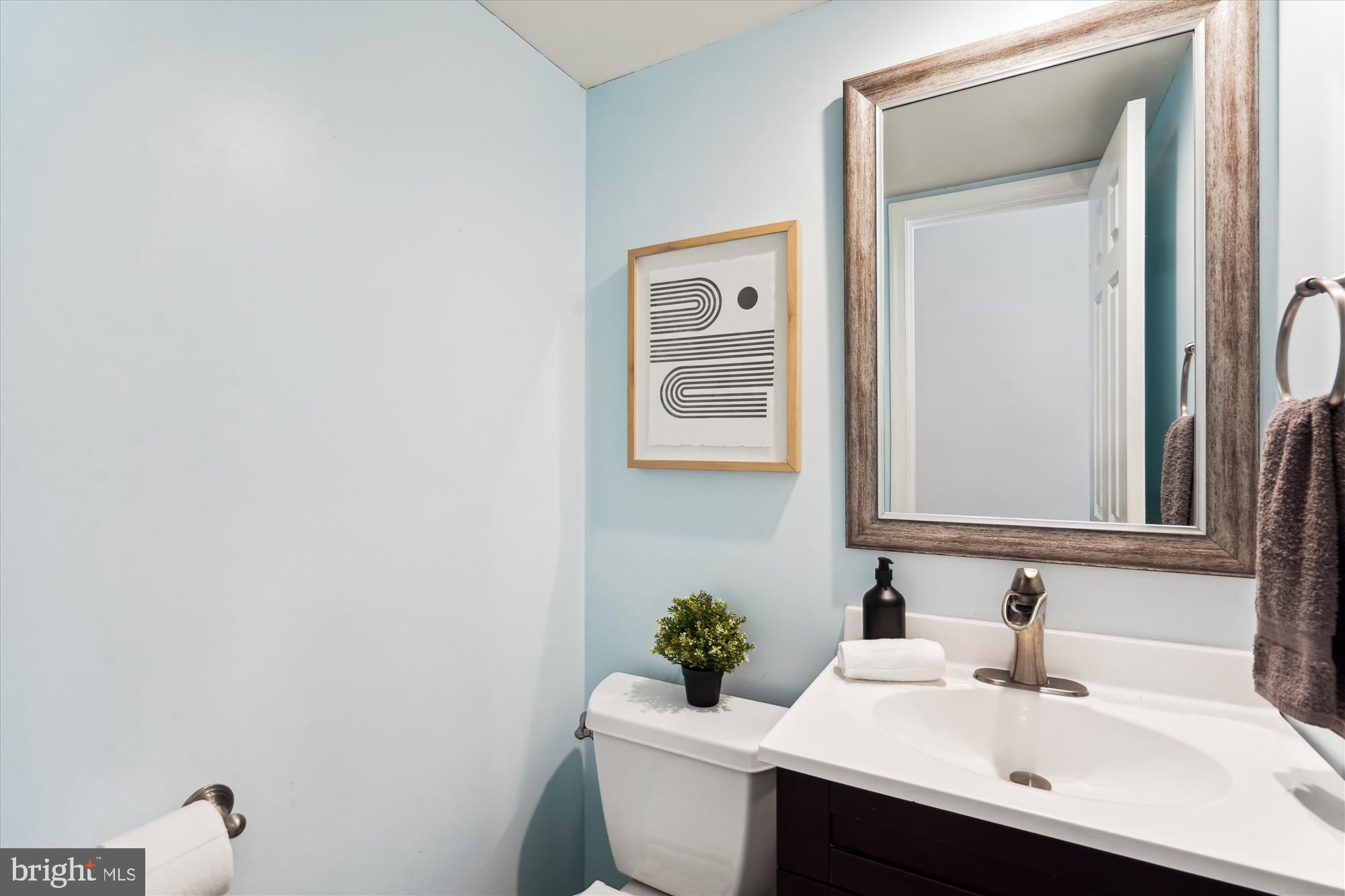 5427 Rilian Court Burke, VA 22015 - Photo 18 of 63 a bathroom with a sink mirror and toilet