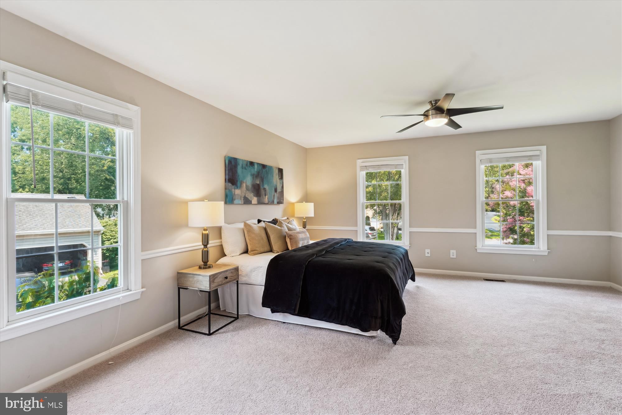 5427 Rilian Court Burke, VA 22015 - Photo 19 of 63 a spacious bedroom with a bed and a large window