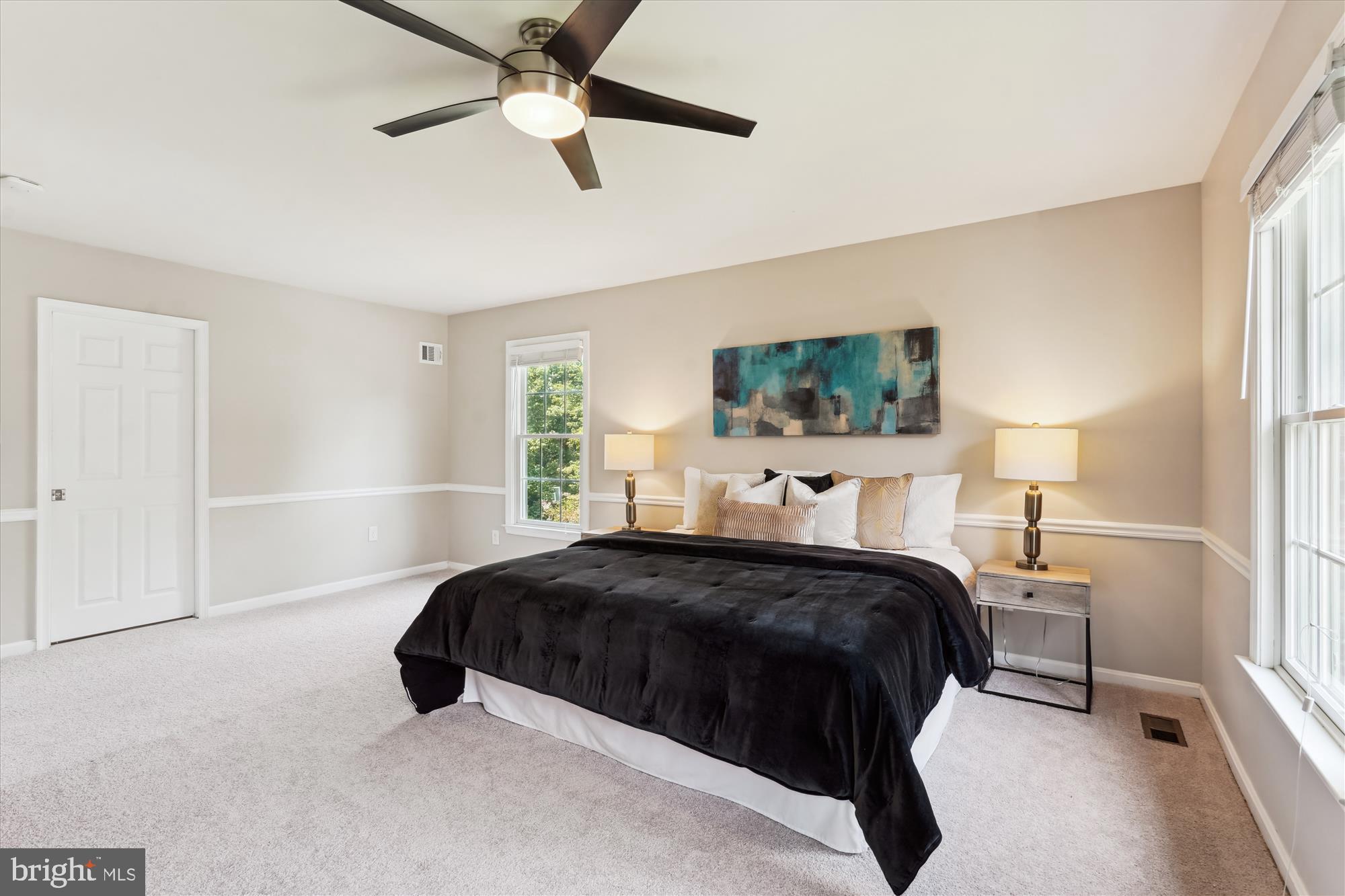 5427 Rilian Court Burke, VA 22015 - Photo 21 of 63 a bedroom with a bed and a window
