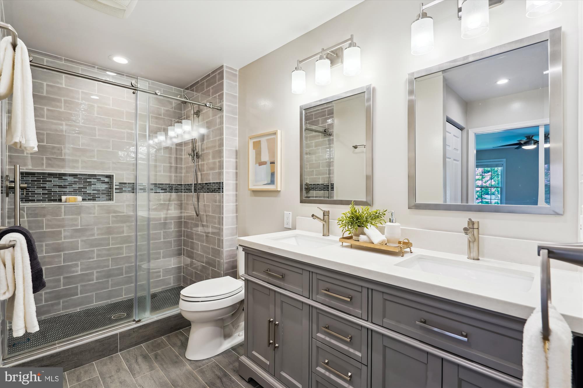 5427 Rilian Court Burke, VA 22015 - Photo 22 of 63 a bathroom with a sink a toilet and shower