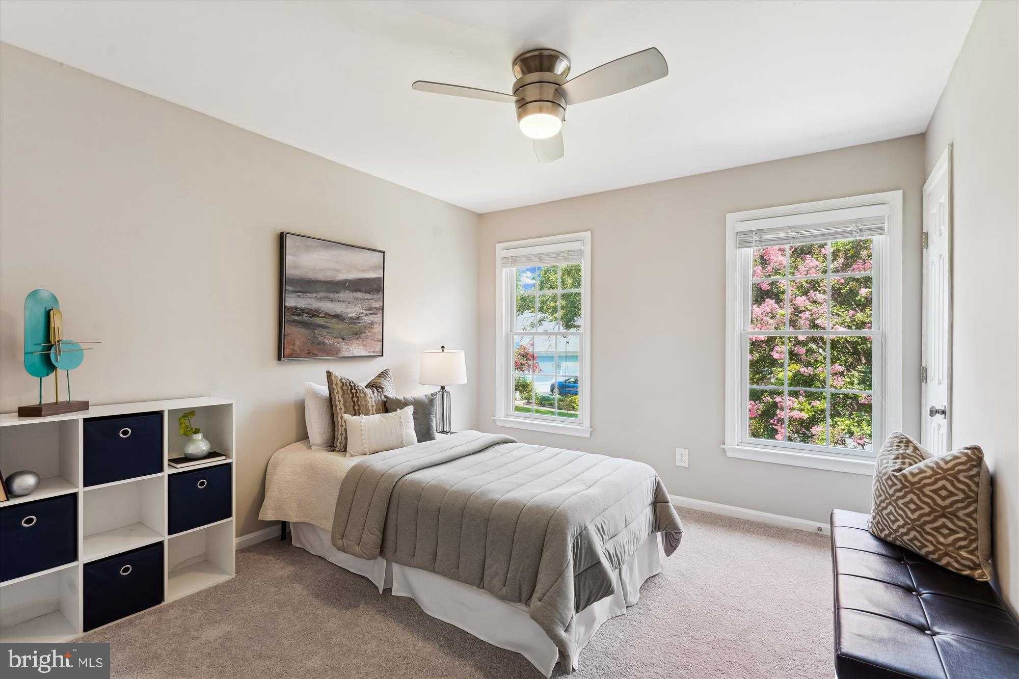 5427 Rilian Court Burke, VA 22015 - Photo 28 of 63 a bedroom with a bed a window and book shelf