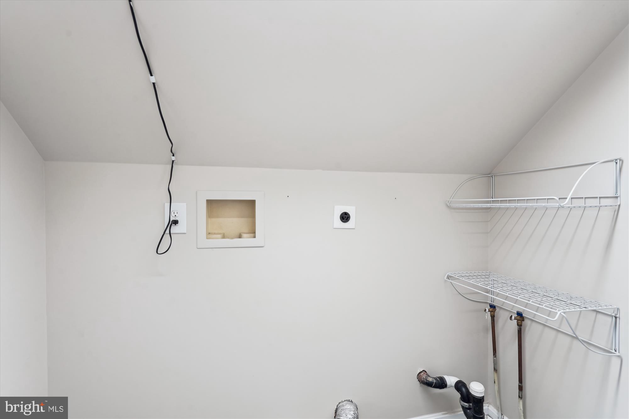 5427 Rilian Court Burke, VA 22015 - Photo 36 of 63 a view of a room with racks on the wall