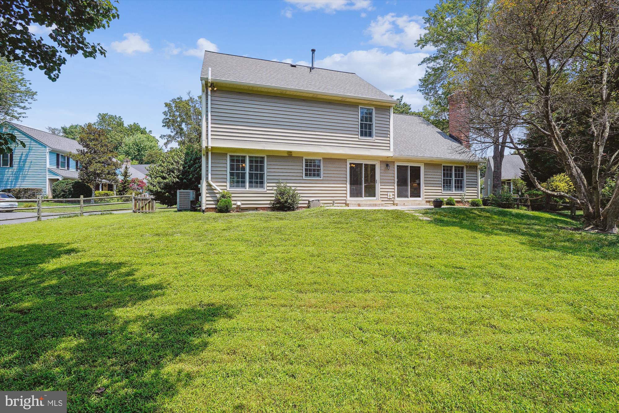 5427 Rilian Court Burke, VA 22015 - Photo 52 of 63 a view of a house with a big yard and large trees