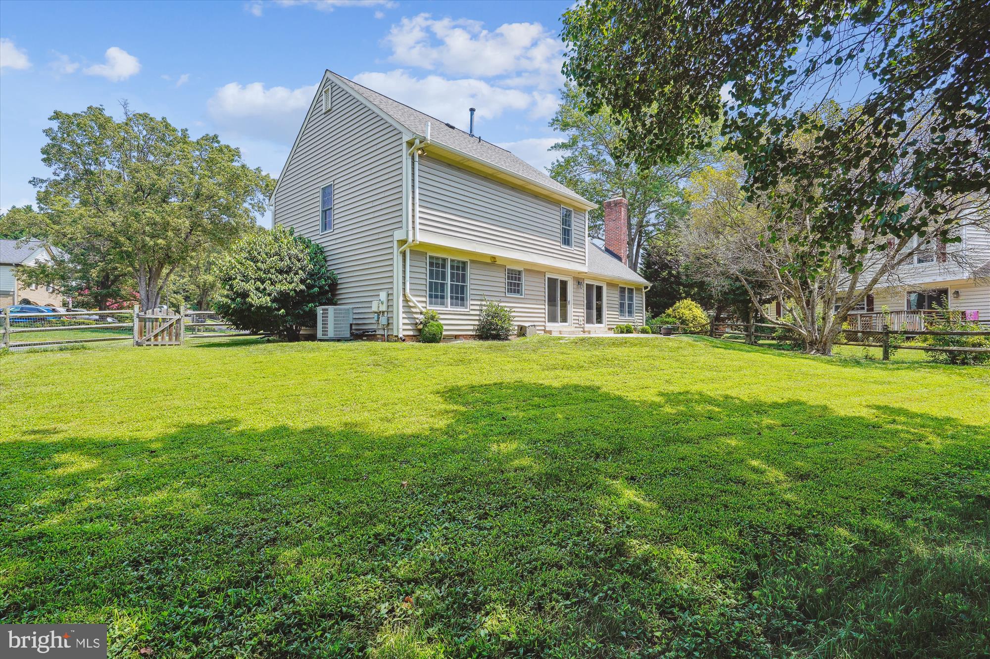 5427 Rilian Court Burke, VA 22015 - Photo 55 of 63 a view of a house with a big yard and large trees