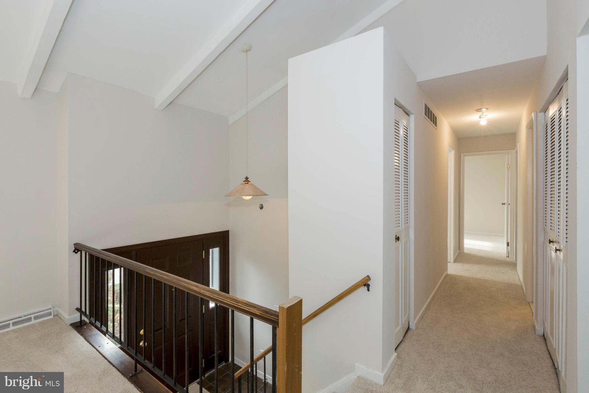 6158 Stevens Forest Road Columbia, MD 21045 - Photo 4 of 30 a view of a hallway with wooden floor and entryway