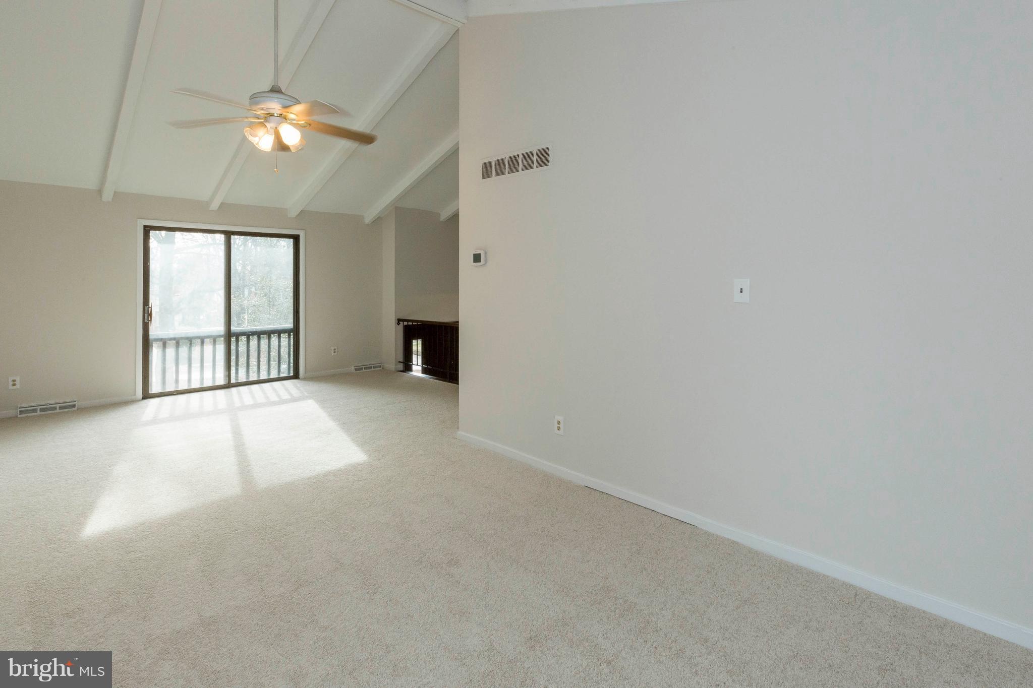6158 Stevens Forest Road Columbia, MD 21045 - Photo 5 of 30 wooden floor in an empty room with a window