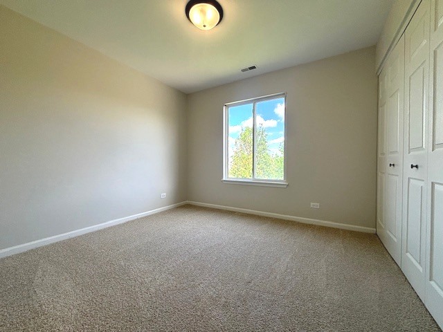 508 Ramsden Road Plano, IL 60545 - Photo 16 of 20 an empty room with windows