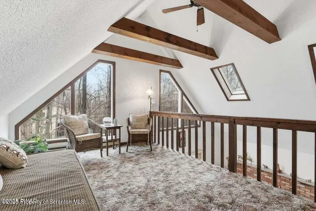 a view of staircase with furniture and floor to ceiling window
