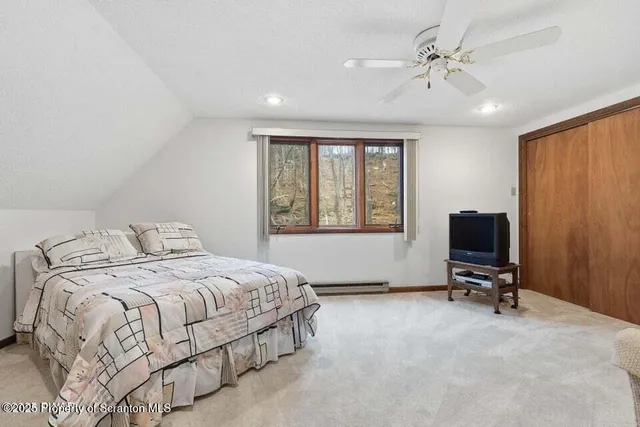 a bedroom with a bed and tv