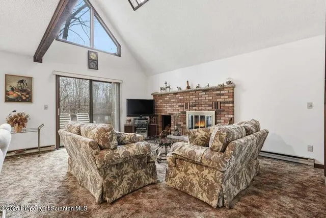 a living room with furniture or couch and a flat screen tv