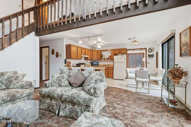a living room with furniture window and a table
