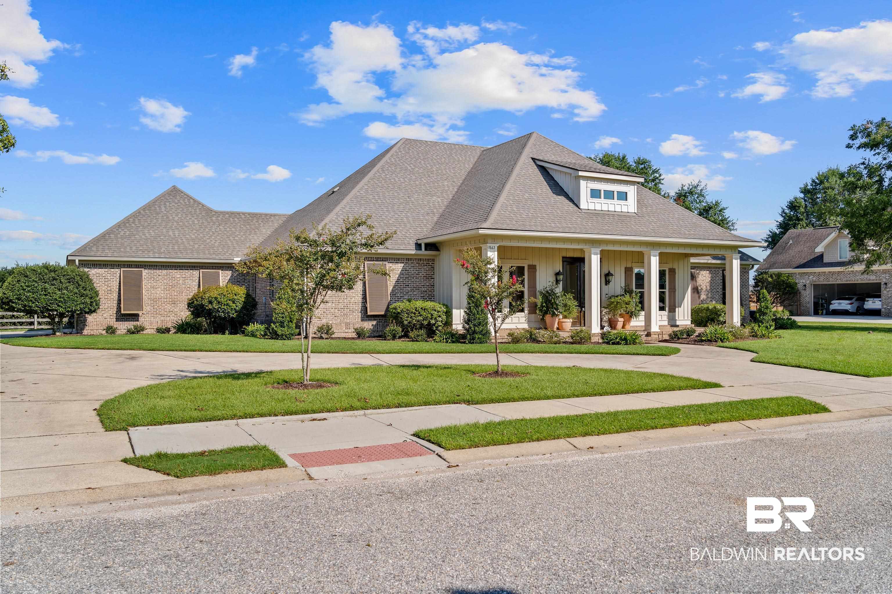 17663 Burwick Loop Fairhope, AL 36532 - Photo 3 of 41 View of front facade with a front lawn and a porch
