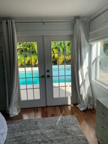 a view of a room with a large window