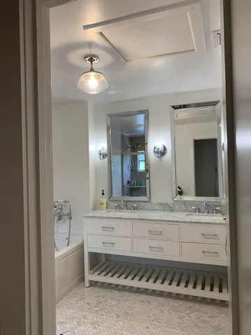 a bathroom with a sink and a mirror
