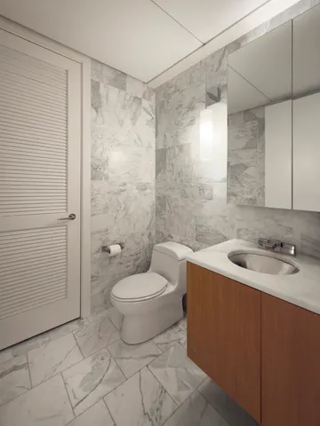a spacious bathroom with a tub sink and mirror
