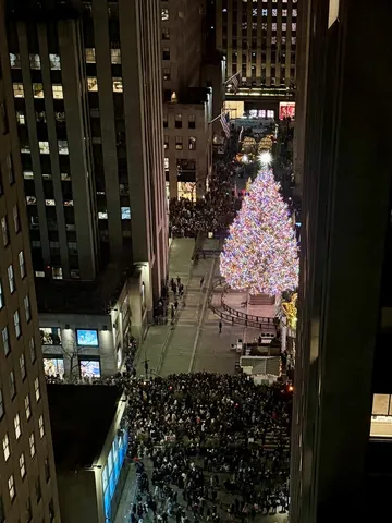 a living room with furniture and wall paintings