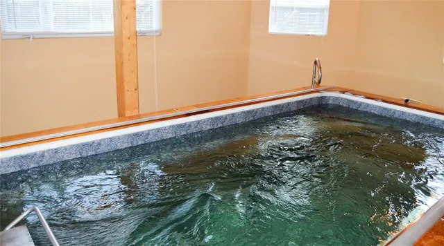 a bed room with a bed and a window