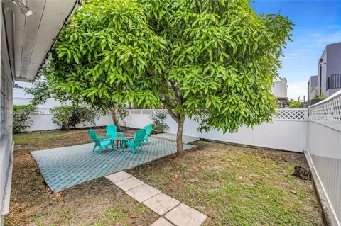 a view of a bench in a backyard