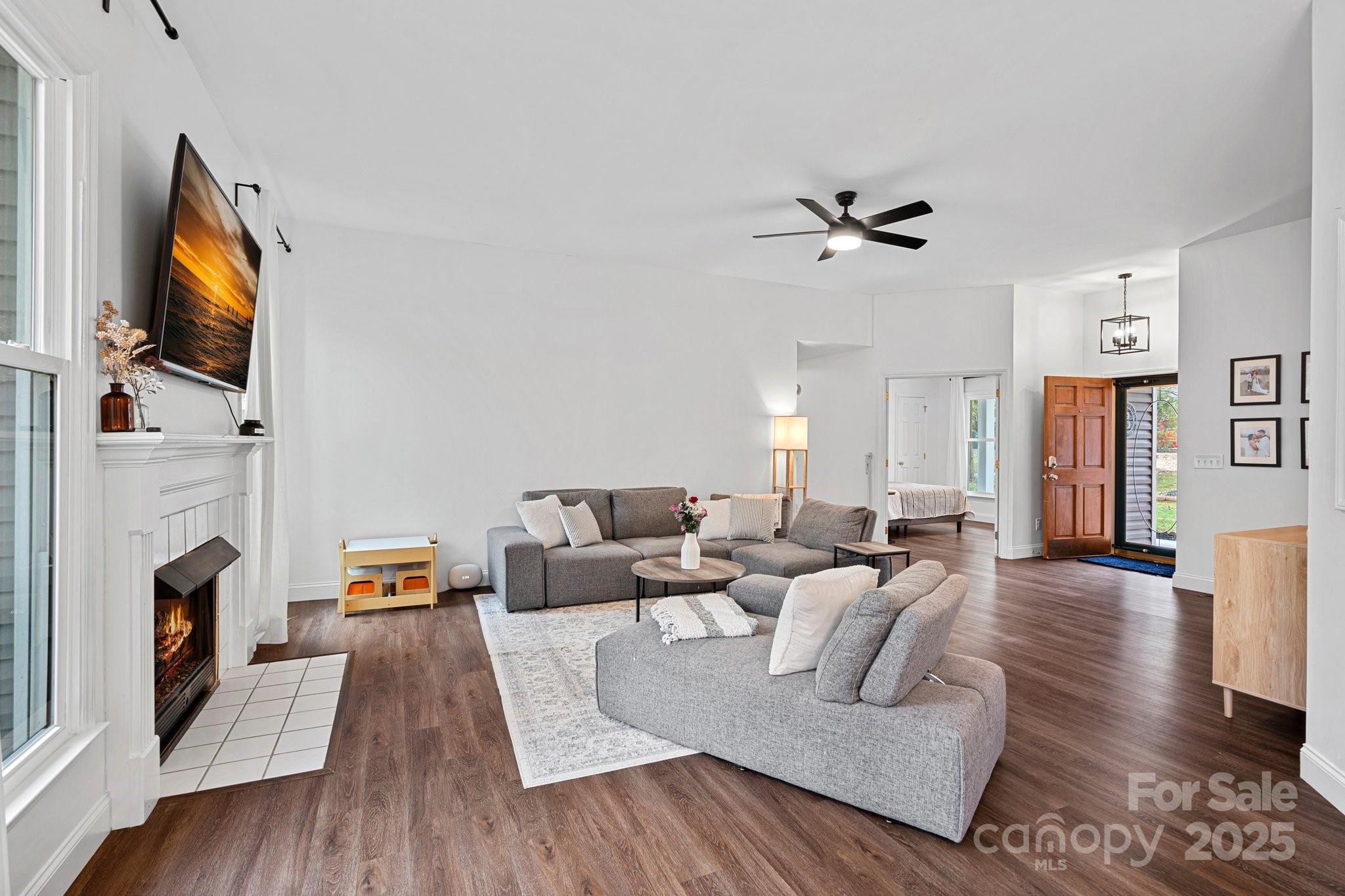120 Banks Ridge Road Fort Mill, SC 29715 - Photo 13 of 37 a living room with fireplace furniture and a flat screen tv
