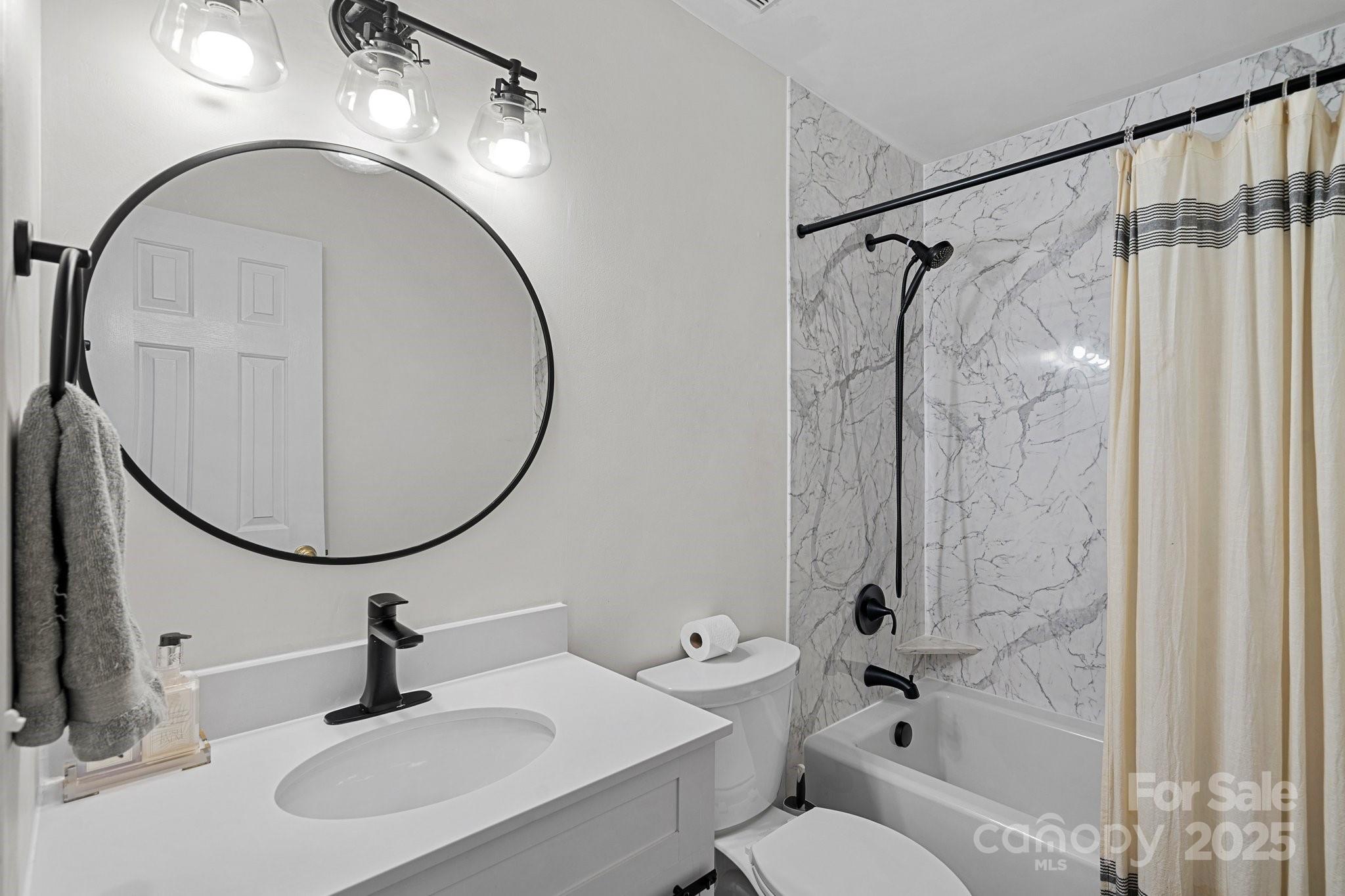 120 Banks Ridge Road Fort Mill, SC 29715 - Photo 19 of 37 a bathroom with a sink and a mirror