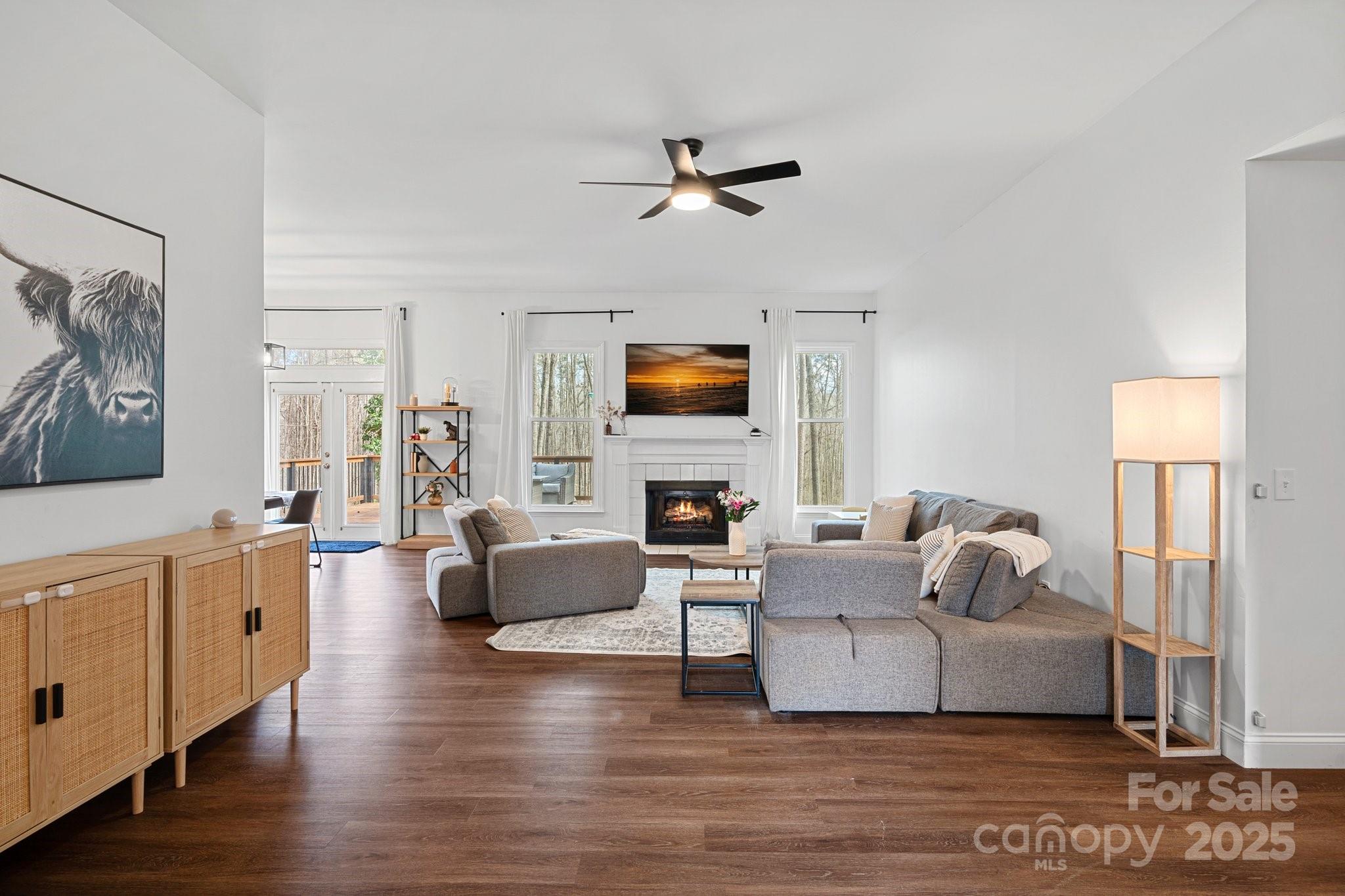 120 Banks Ridge Road Fort Mill, SC 29715 - Photo 3 of 37 a living room with fireplace furniture and a wooden floor