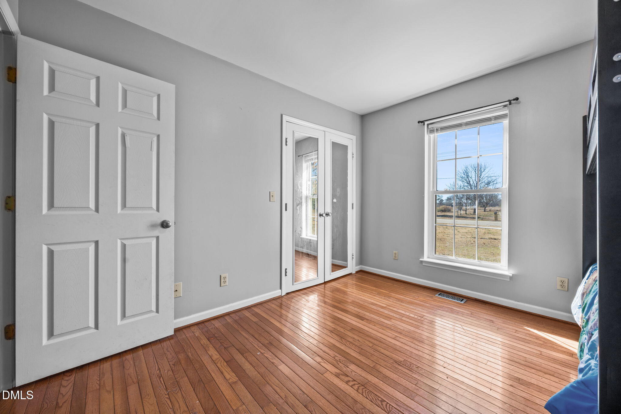 3431 Old Stage Road South Erwin, NC 28339 - Photo 17 of 53 a view of an empty room with wooden floor and a window