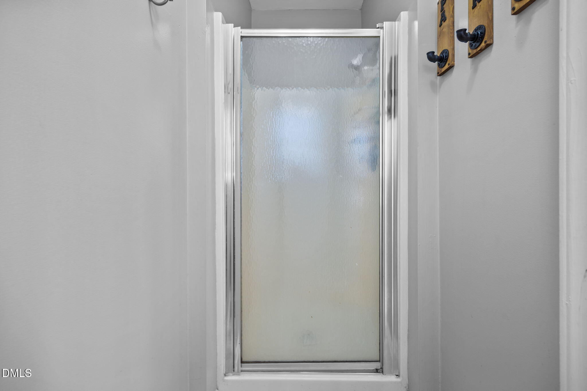 3431 Old Stage Road South Erwin, NC 28339 - Photo 40 of 53 a bathroom with a glass shower door