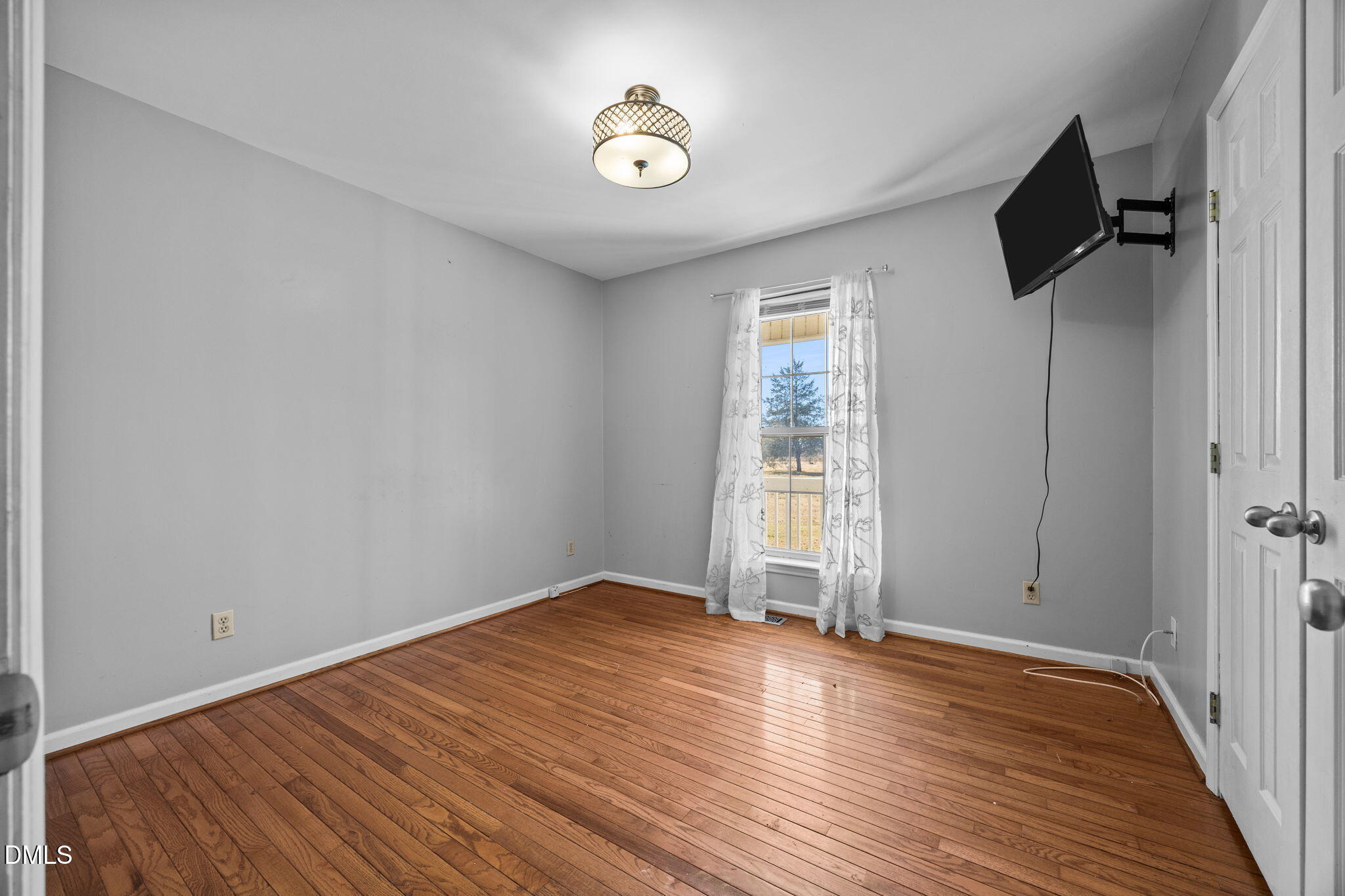 3431 Old Stage Road South Erwin, NC 28339 - Photo 41 of 53 wooden floor in an empty room with a window