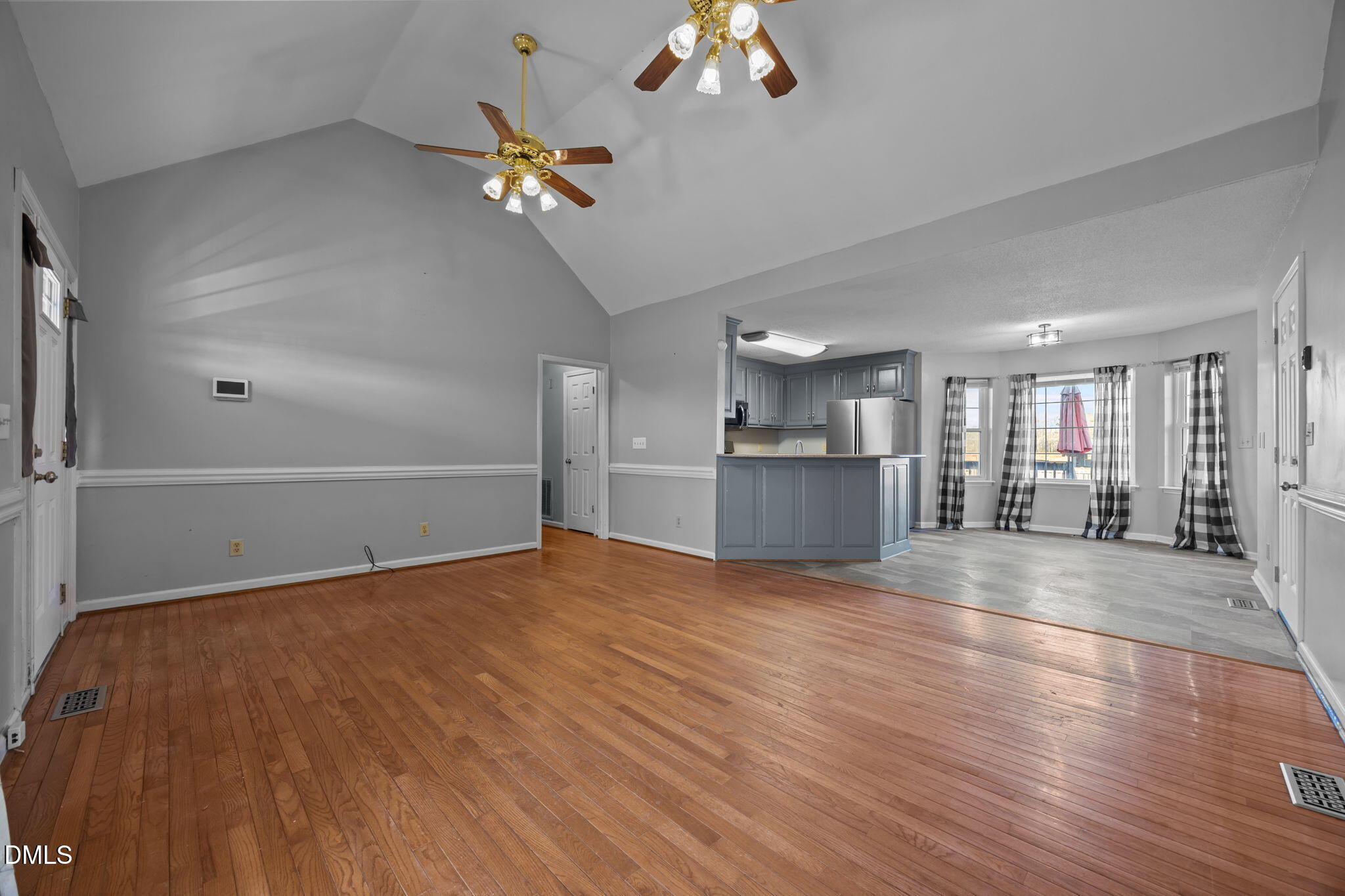 3431 Old Stage Road South Erwin, NC 28339 - Photo 6 of 53 a view of a livingroom with a ceiling fan wooden floor and a kitchen