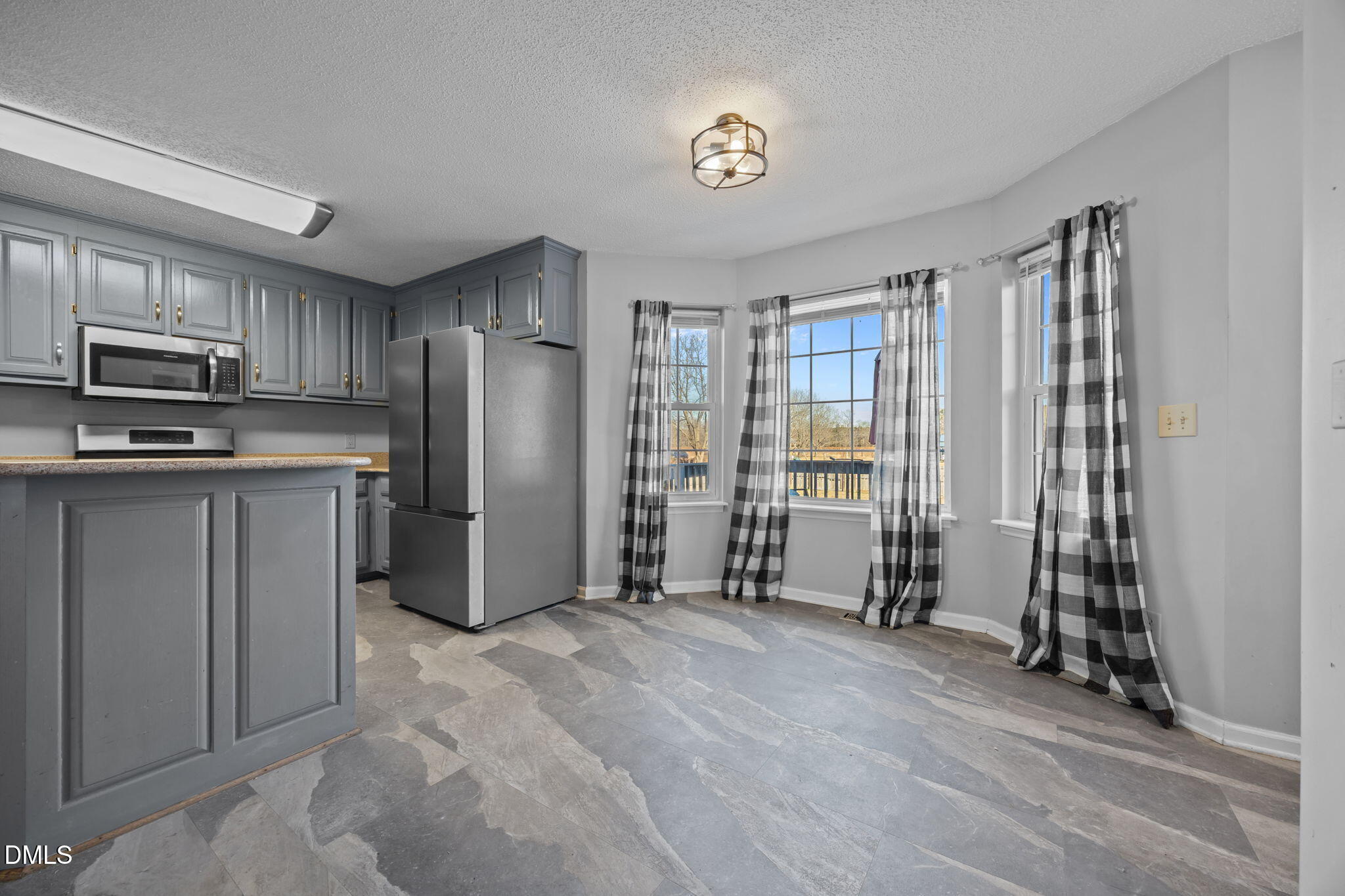 3431 Old Stage Road South Erwin, NC 28339 - Photo 8 of 53 a kitchen with stainless steel appliances granite countertop a refrigerator oven a stove top oven with a sink and dishwasher