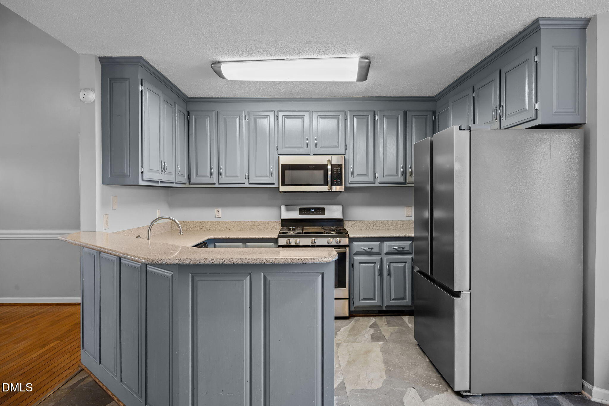 3431 Old Stage Road South Erwin, NC 28339 - Photo 10 of 53 a kitchen with stainless steel appliances granite countertop a refrigerator stove a sink and dishwasher