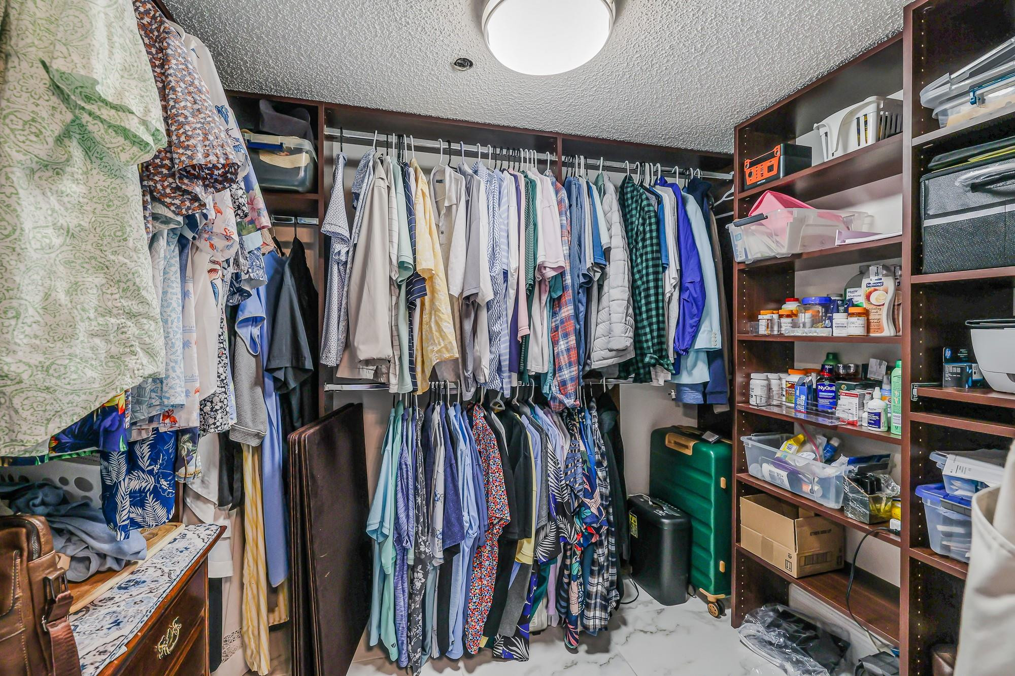 3520 Oaks Way, Unit 809 Pompano Beach, FL 33069 - Photo 34 of 39 Primary bedroom closet