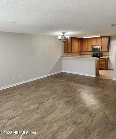 a view of kitchen with cabinets