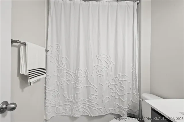 a bathroom with a shower curtain