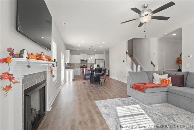 a living room with furniture and a fireplace