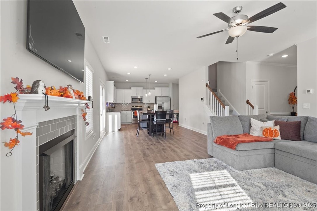 7840 Rufus Johnson Road Fayetteville, NC 28306 - Photo 17 of 50 a living room with furniture and a fireplace